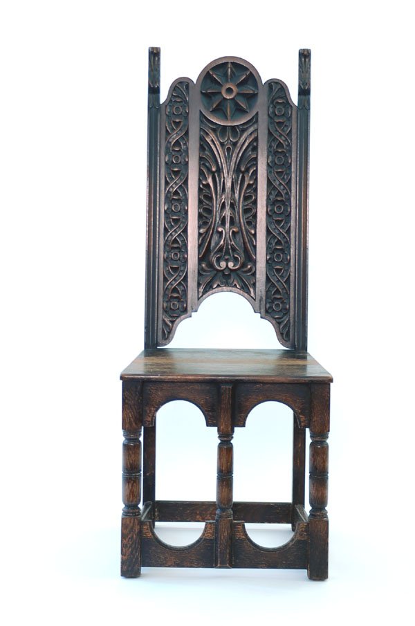 Appraisal: Gothic style side chair with a deep carved back and