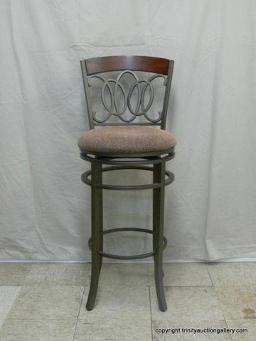 Appraisal: Ornamental Metal Teak Swivel Bar Stool - Metal art design