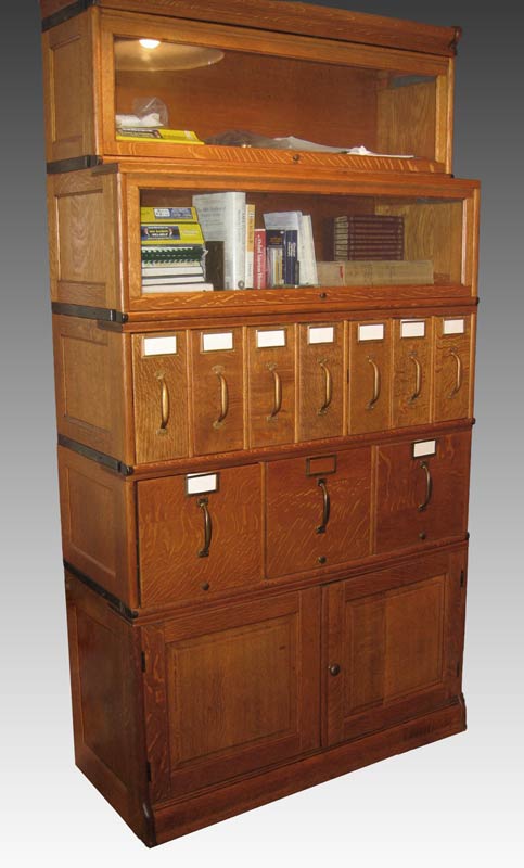 Appraisal: VINTAGE STACK OAK FILE AND BOOKCASE Top sections are glass