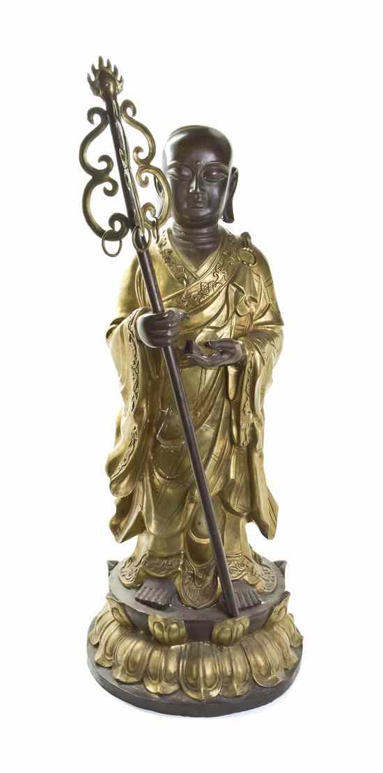 Appraisal: A Bronze Model of a Buddhist Disciple the standing figure