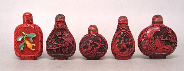 Appraisal: A group of five molded cinnabar snuff bottles four with