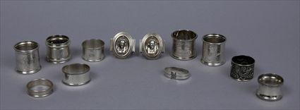 Appraisal: GROUP OF EIGHT AMERICAN SILVER-PLATED NAPKIN RINGS AND OTHER SILVER