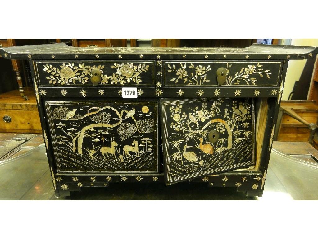 Appraisal: An oriental black lacquered table cabinet decoratively inlaid with mother-of-pearl