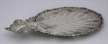 Appraisal: TIFFANY CO MONOGRAMMED SILVER SHELL-FORM DISH The oblong fluted surface