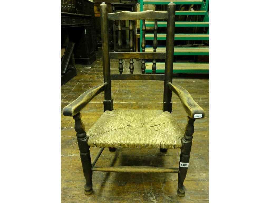 Appraisal: A Lancashire style turned spindle back child's open elbow chair