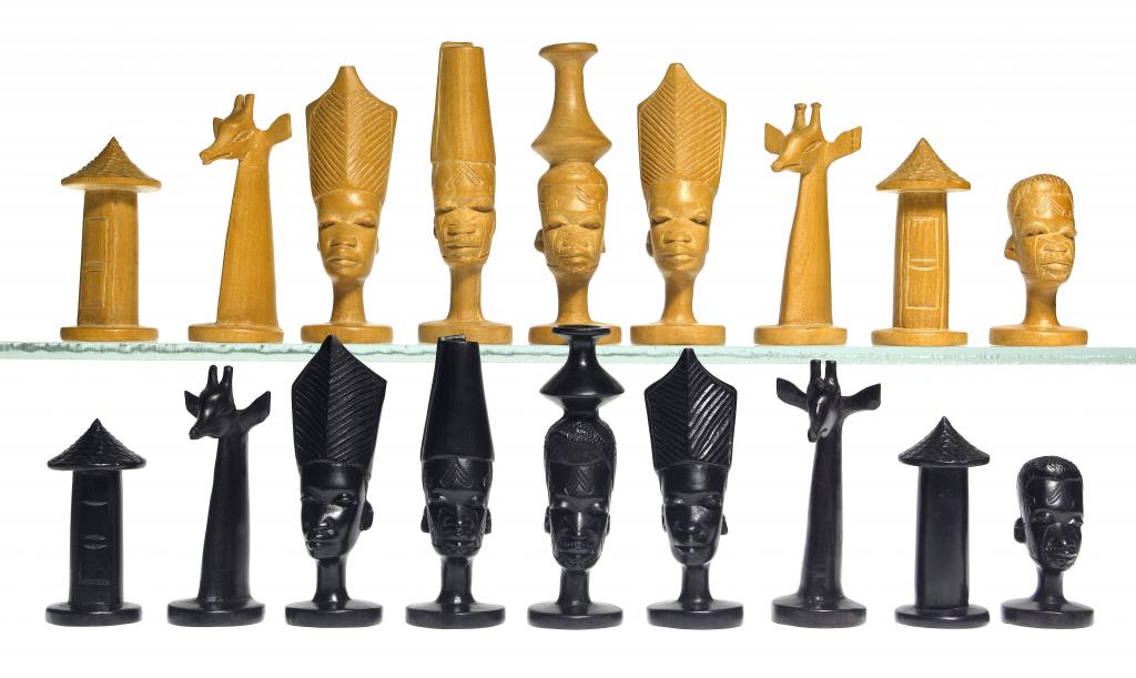 Appraisal: A MAKONDE HARDWOOD CHESS SET of dark and light coloured