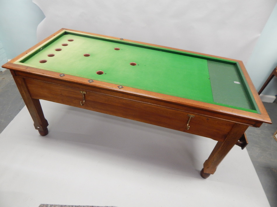 Appraisal: An early to mid thC oak coin operated bar billiards