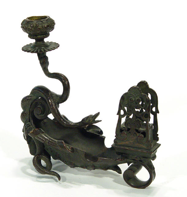 Appraisal: Ornate bronze desk candlestick supported by birds heads with match