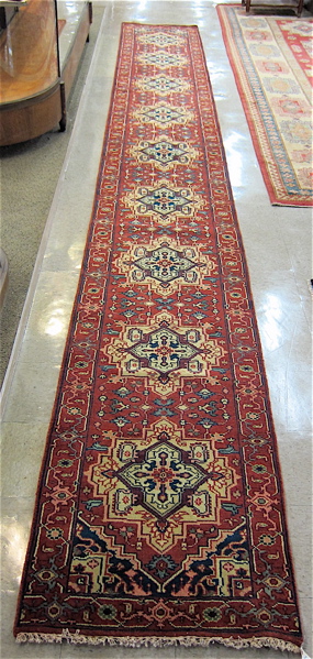 Appraisal: HAND KNOTTED ORIENTAL LONG RUG Persian Serapi design of nine