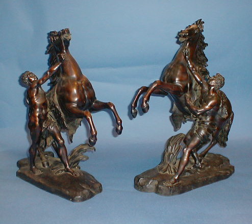 Appraisal: A pair of late thC bronze Marley horses with attendants