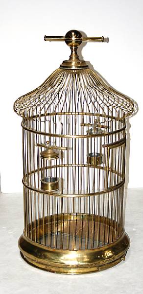 Appraisal: A large brass wirework circular parrot cage last quarter th