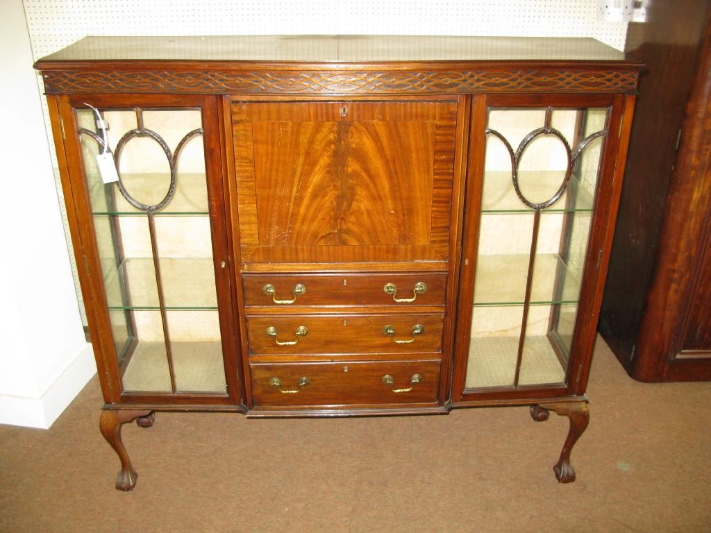 Appraisal: A George V mahogany bureau cabinet blind-fret frieze above fall-front