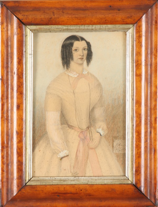 Appraisal: Knees up portrait of a young woman wearing peach colored