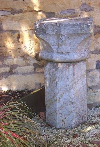 Appraisal: An octagonal stone column with carved capital cm high