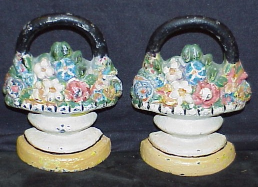 Appraisal: Pair of iron flower basket doorstops polychrome flowers h