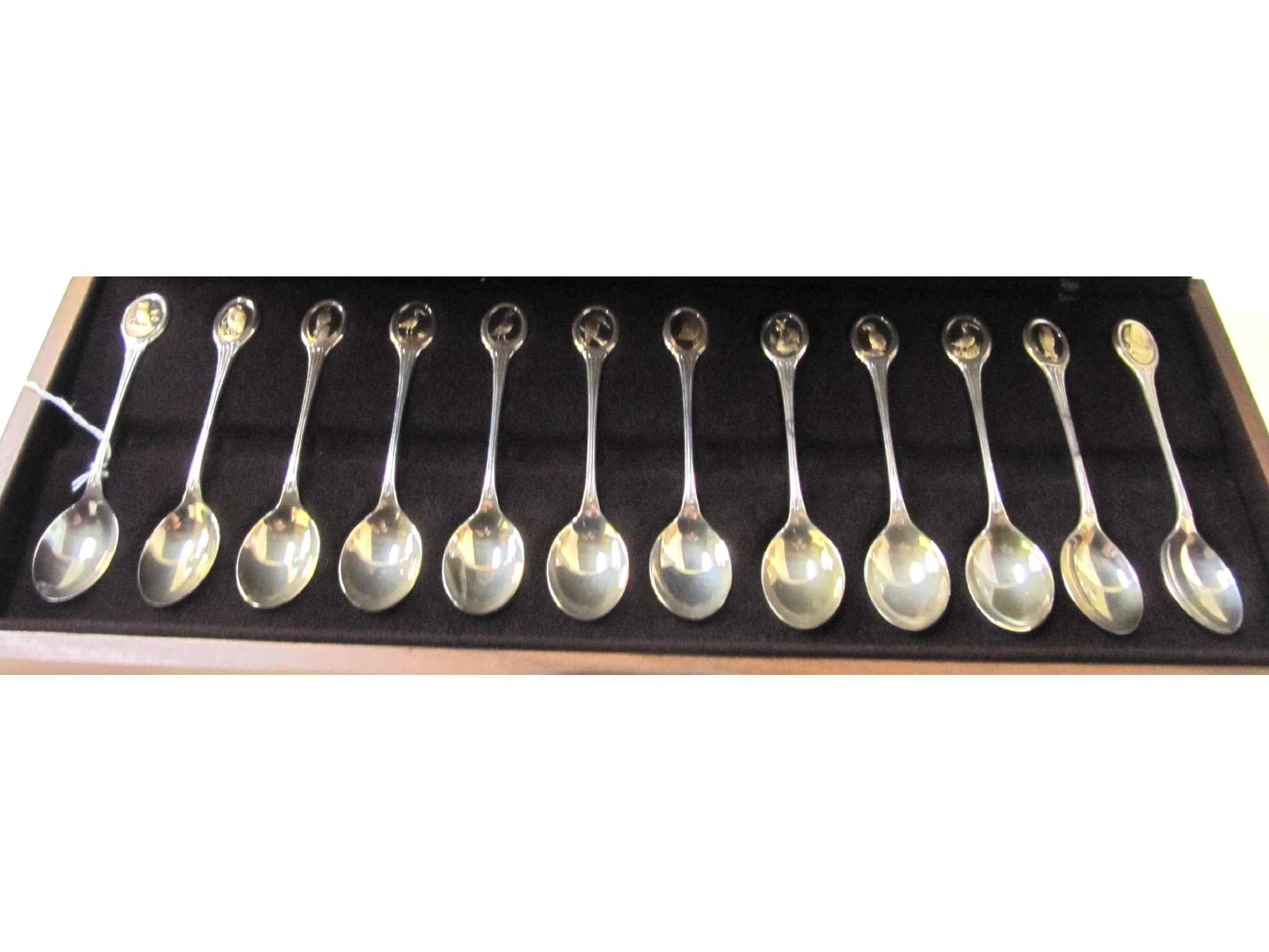 Appraisal: A lot comprising two cased sets of twelve silver spoons