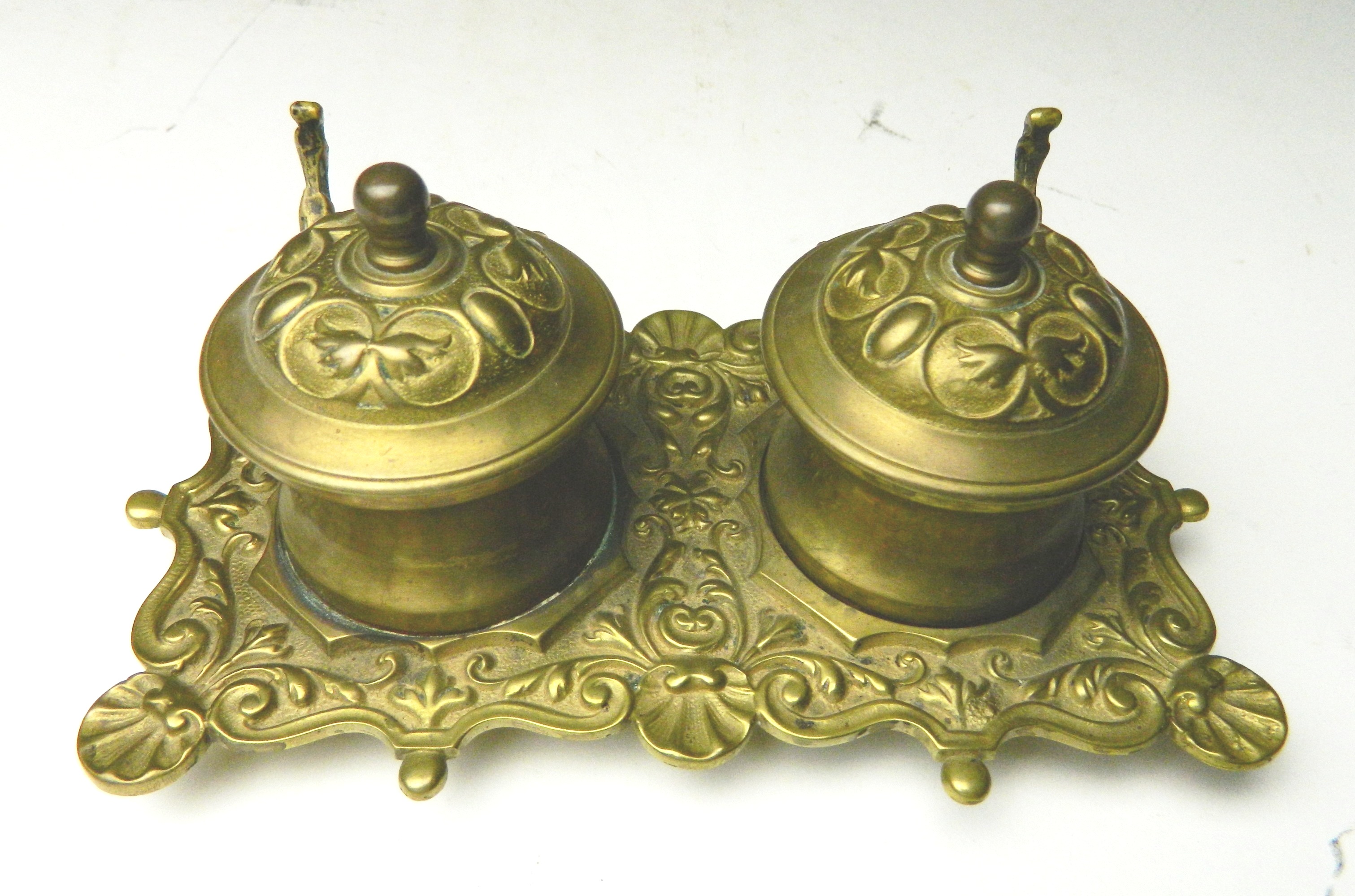 Appraisal: French brass double inkstand with scroll work and shell forms