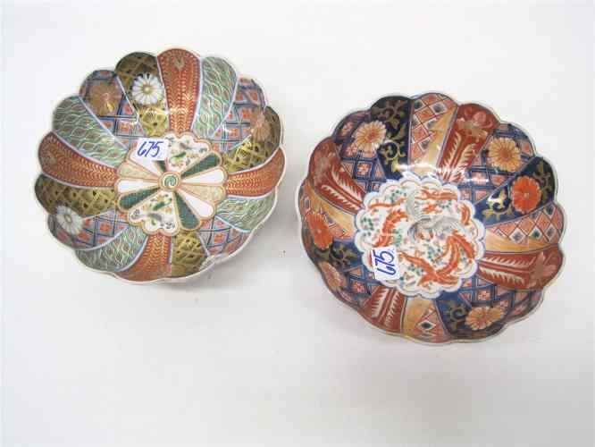 Appraisal: TWO JAPANESE IMARI PORCELAIN BOWLS having curved panels of stylized