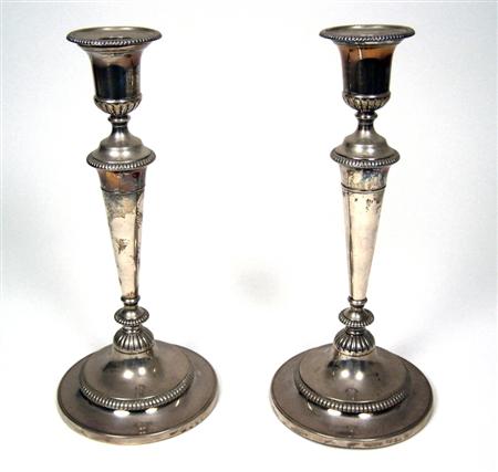 Appraisal: A pair of George III table candle sticks J Green