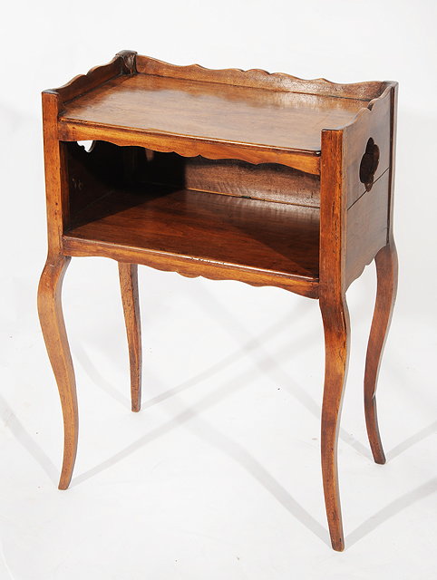 Appraisal: AN ANTIQUE CONTINENTAL WALNUT BEDSIDE TABLE with galleried top above