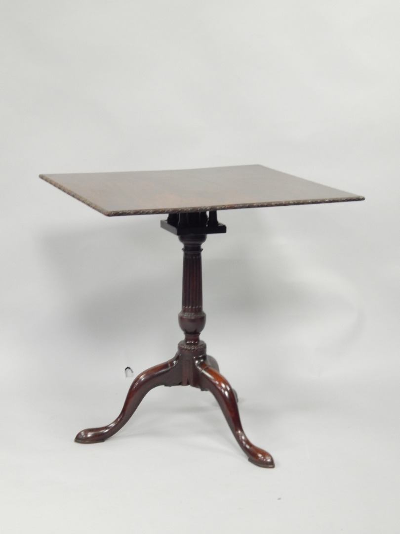 Appraisal: A Georgian mahogany tilt top table having floral relief moulded