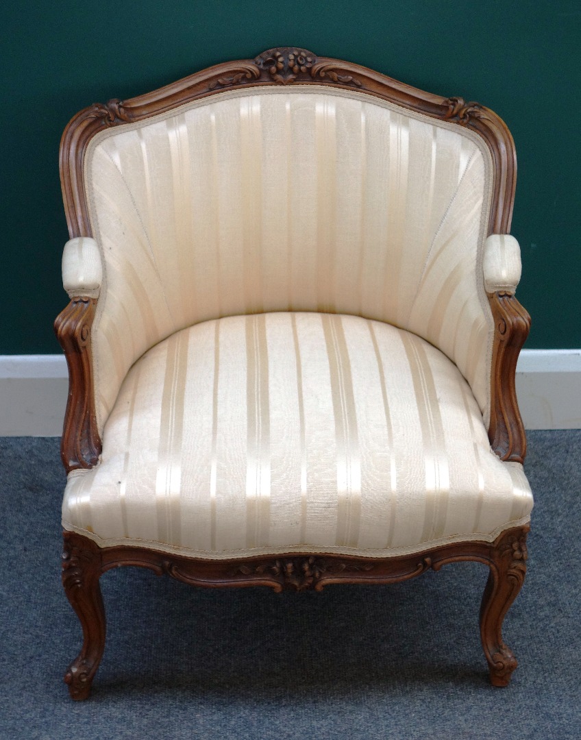 Appraisal: A Louis XV style small walnut framed tub back chair