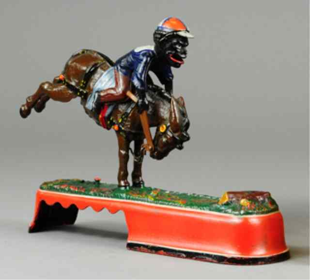 Appraisal: SPISE A MULE JOCKEY MECHANICAL BANK J E Stevens Co