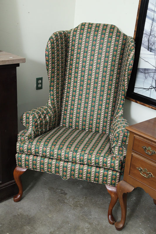 Appraisal: WINGBACK CHAIR Alternating green and red floral upholstery on a