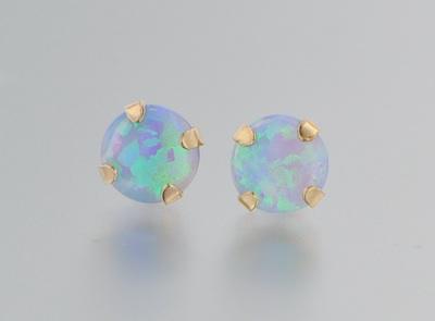 Appraisal: A Pair of Blue Opal Gold Ear Studs A pair