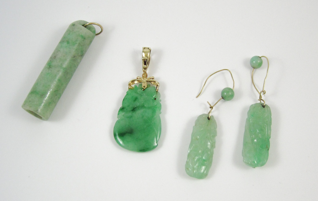 Appraisal: FOUR ARTICLES OF JADE AND YELLOW GOLD JEWELRY including a