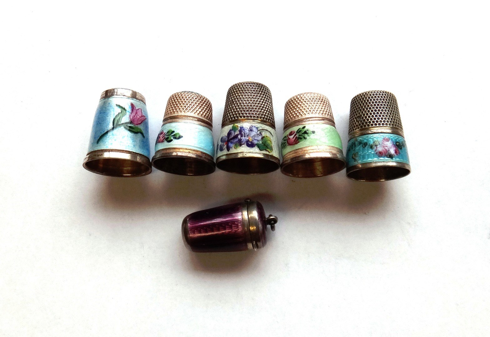 Appraisal: An Austrian silver and purple enamel thimble holder of tapering