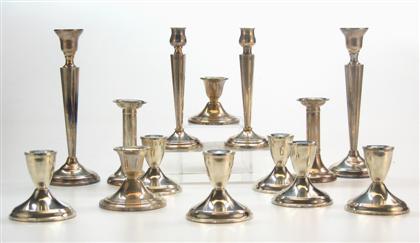 Appraisal: Seven pair of weighted base sterling silver candlesticks H in