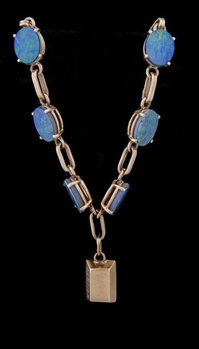 Appraisal: Gold and Opal Doublet Bracelet Charm signed Cartier in Provenance