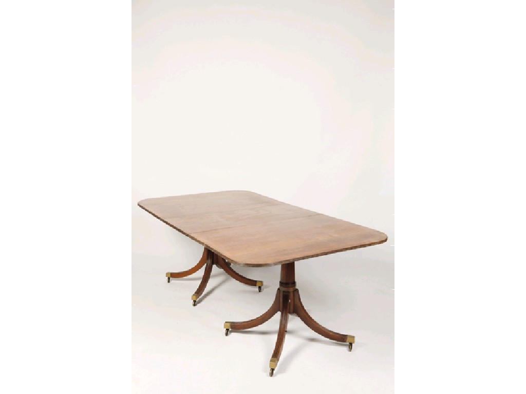 Appraisal: A REGENCY MAHOGANY EXTENDING TWIN PEDESTAL DINING TABLE the rectangular