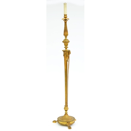 Appraisal: A gilt lacquered brass standard lamp th c in neo