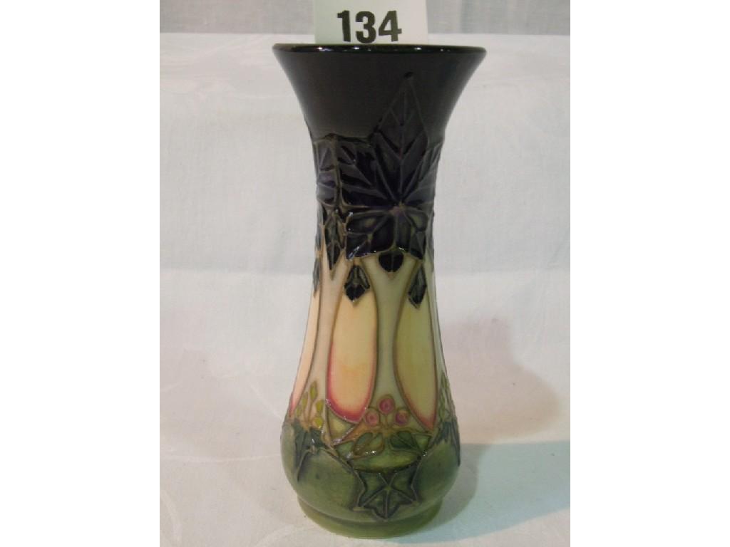 Appraisal: A Moorcroft vase of slender waisted form with stylised pea