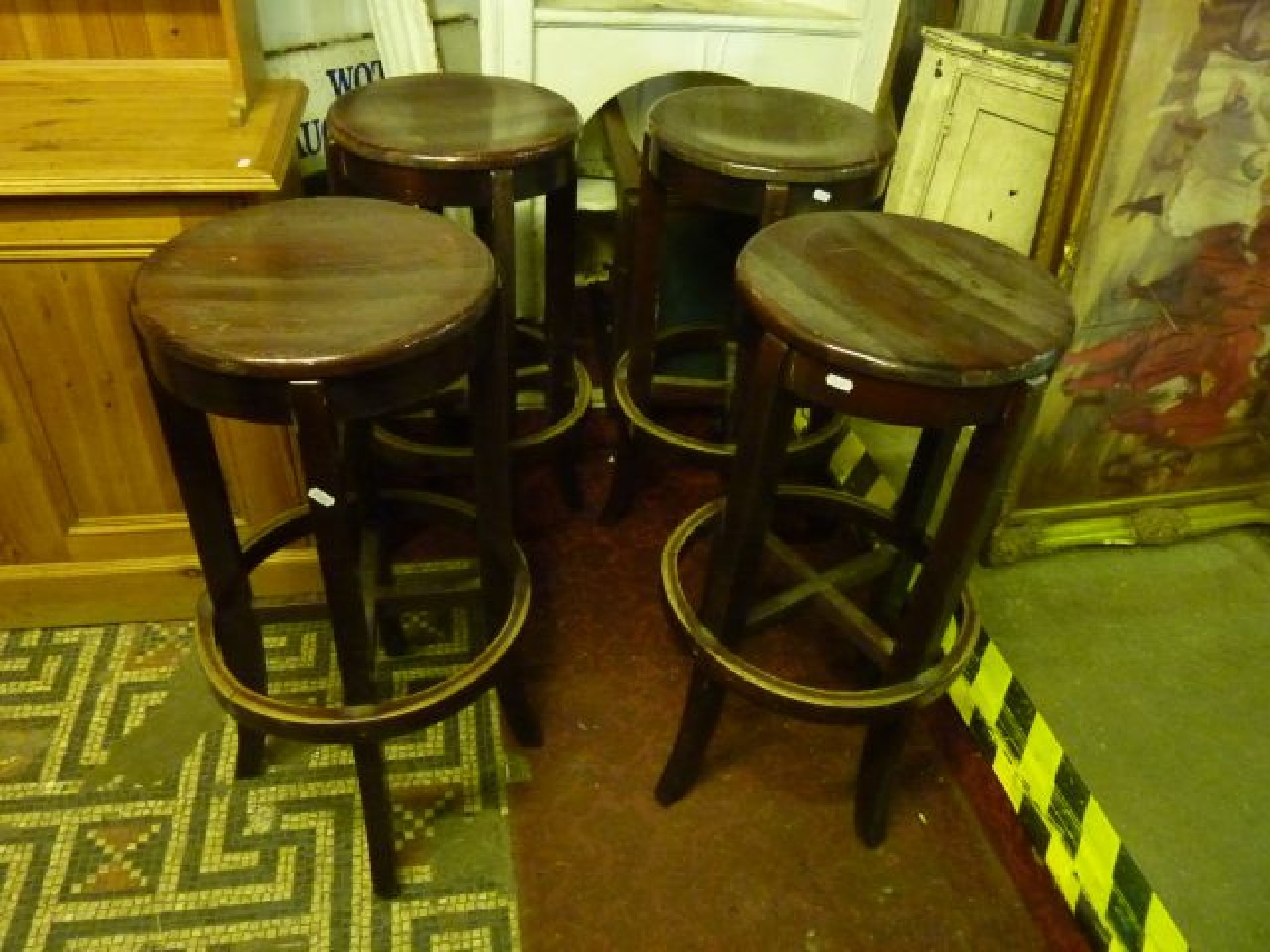 Appraisal: Four bar stools with circular seats and foot rail and