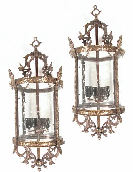 Appraisal: A pair of English style bronze wall lanterns with etched