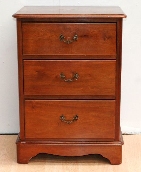 Appraisal: A stained pine bedside chest of three drawers cm wide