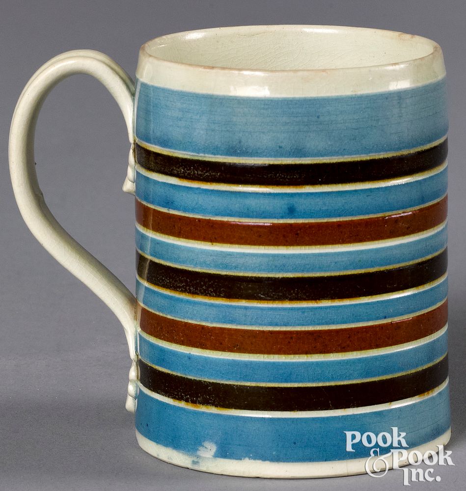 Appraisal: Mocha mug Mocha mug with blue brown and tan bands