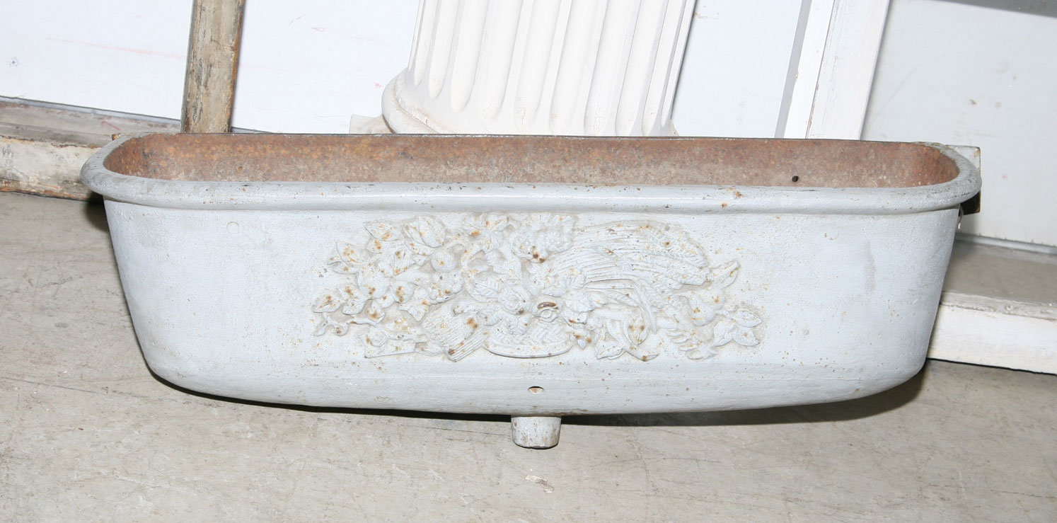 Appraisal: PAIR OF CAST-IRON GRAY-PAINTED WATER TROUGHS WITH FLORAL MOTIF Length