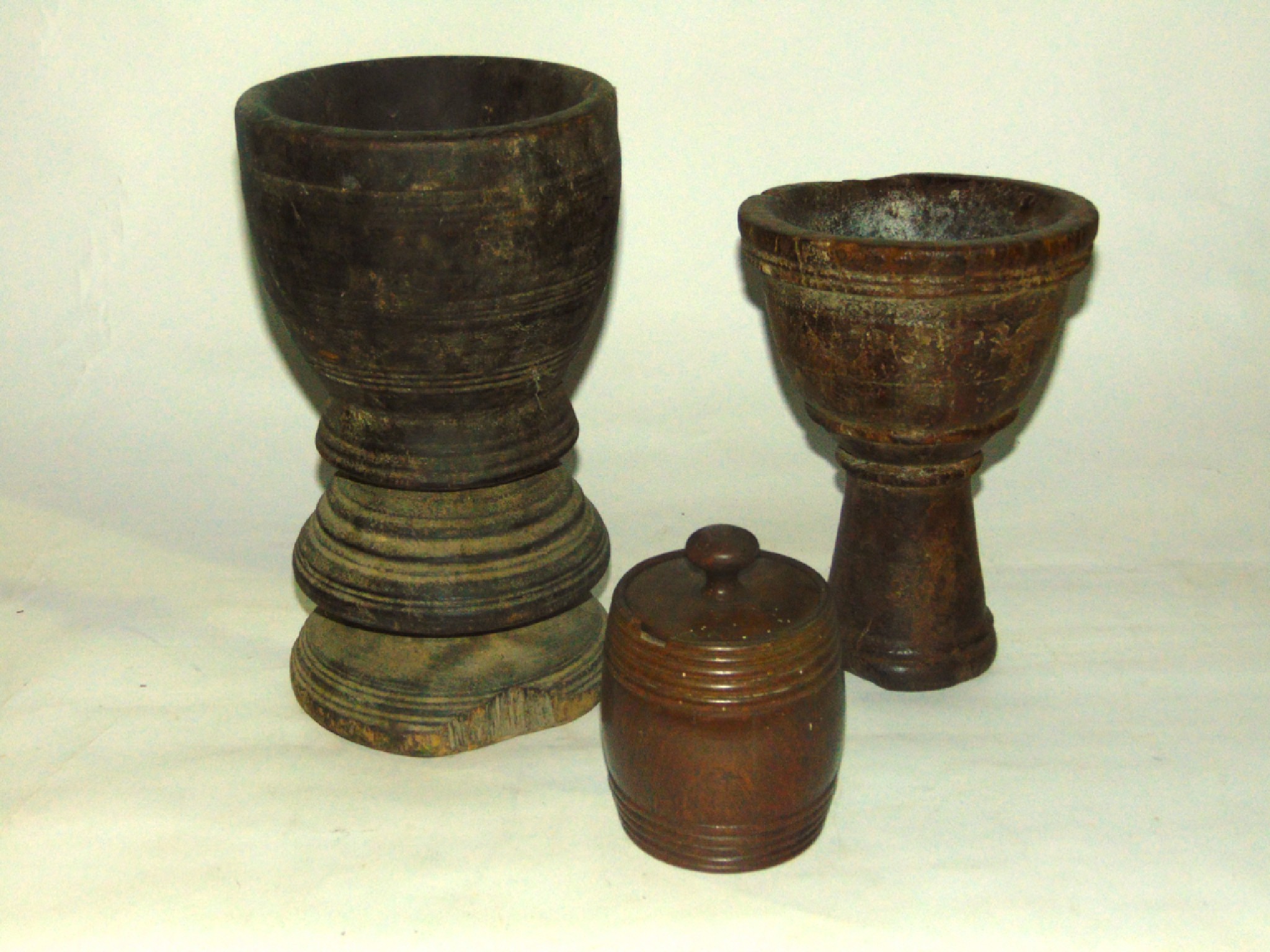 Appraisal: Antique treen to include a large turned footed timber mortar