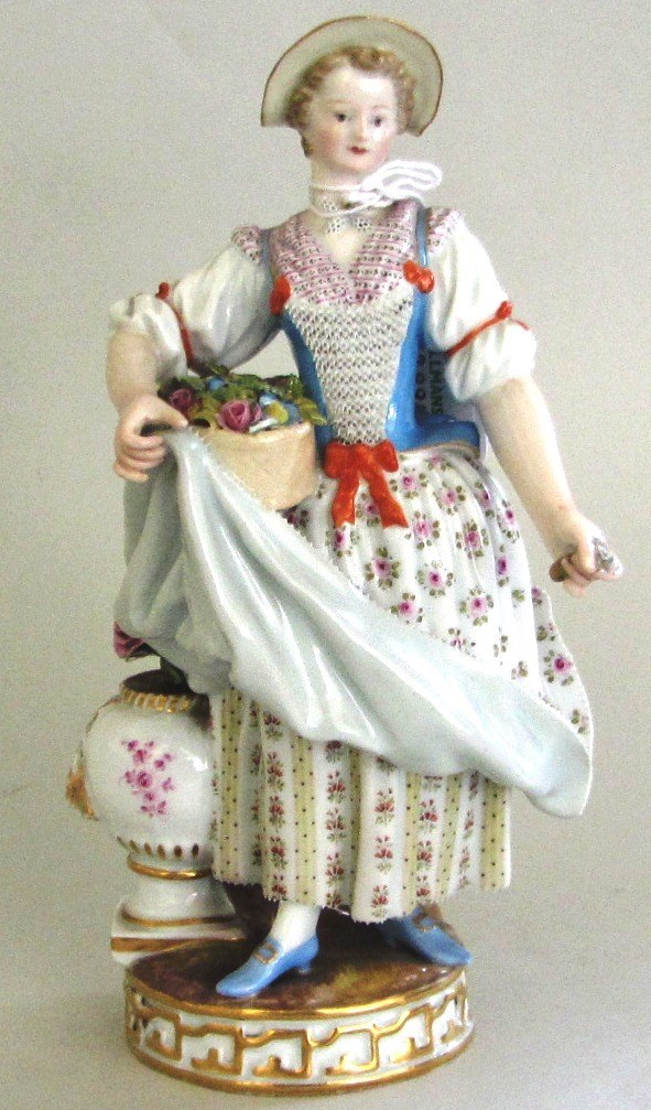 Appraisal: A Meissen figure of a girl carrying a basket of