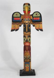 Appraisal: Pacific coast style carved and polychrome decorated totem Pacific Coast