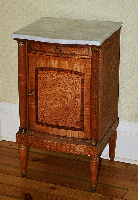 Appraisal: A CONTINENTAL BOW FRONTED ELM MARBLE TOPPED BEDSIDE CABINET with