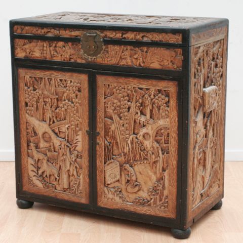 Appraisal: A Chinese carved camphorwood cabinet th century cm long cm