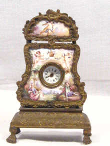 Appraisal: A Viennese bronze and enamel miniature clock cm high