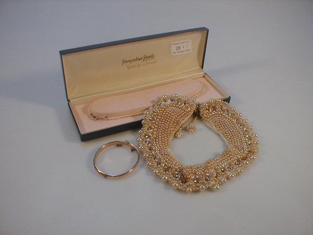 Appraisal: A simulated pearl necklace a gold plated hinged bangle and