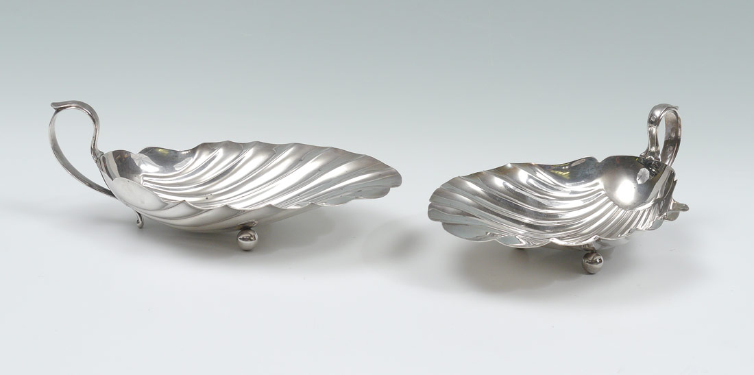 Appraisal: PAIR HIRSH SHELL STERLING SILVER SERVING DISHES Handled and footed