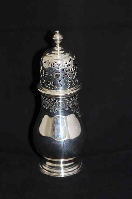 Appraisal: A SILVER SUGAR CASTER the pierced top with turned finial